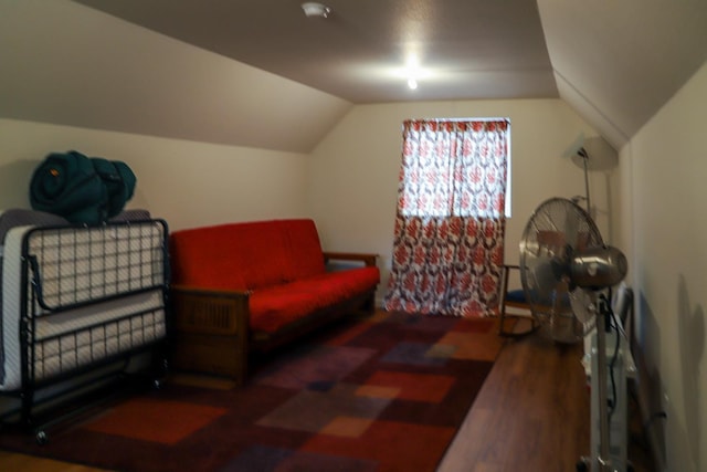 living area with dark wood-type flooring and vaulted ceiling