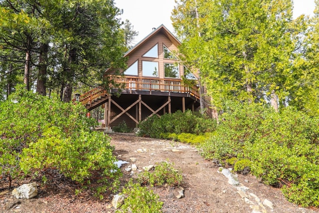 rear view of house with a wooden deck