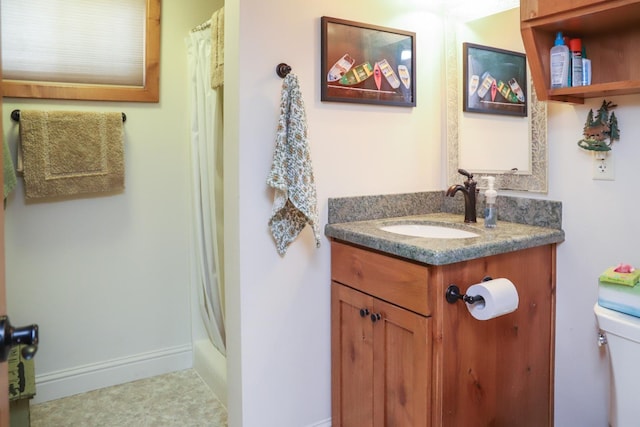 bathroom with vanity, toilet, and a shower with shower curtain