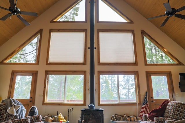 living room with vaulted ceiling, plenty of natural light, and wooden ceiling