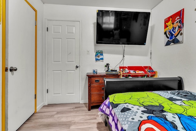 bedroom with wood finished floors