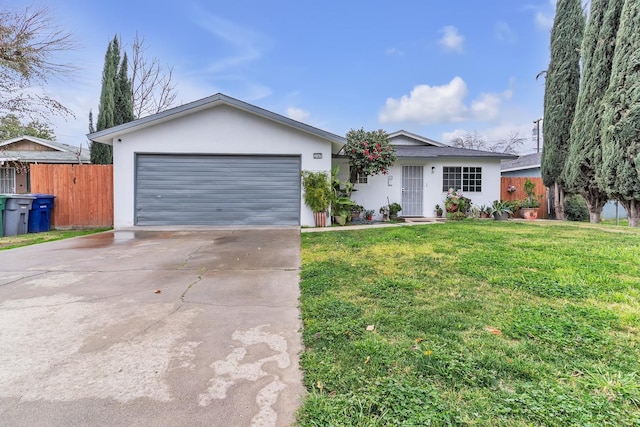 single story home featuring a front yard, fence, driveway, and stucco siding