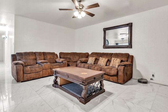 living area featuring visible vents, marble finish floor, and a ceiling fan