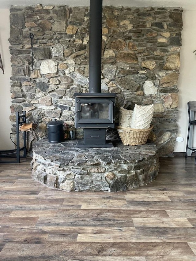 room details with wood-type flooring and a wood stove