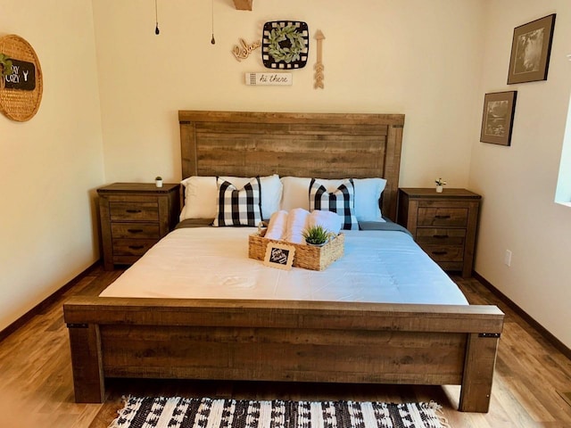 bedroom with wood-type flooring