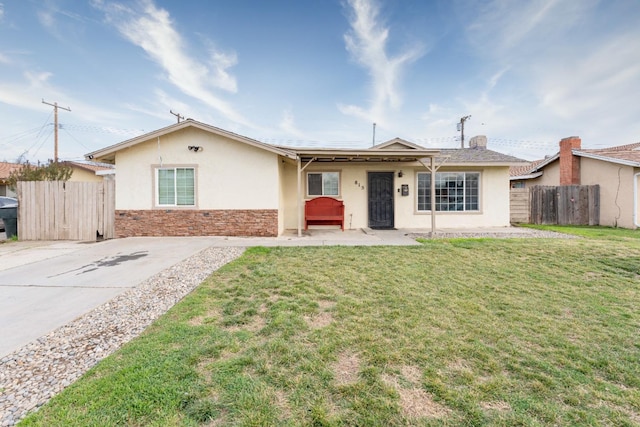 ranch-style house with a front lawn