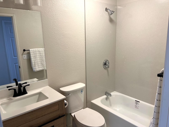 full bathroom featuring bathtub / shower combination, vanity, and toilet