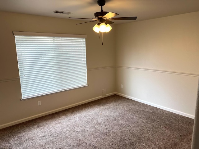 carpeted empty room with ceiling fan