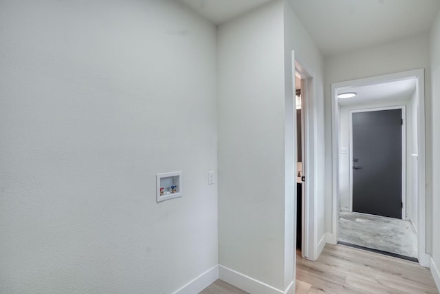 laundry area with washer hookup and light wood-type flooring