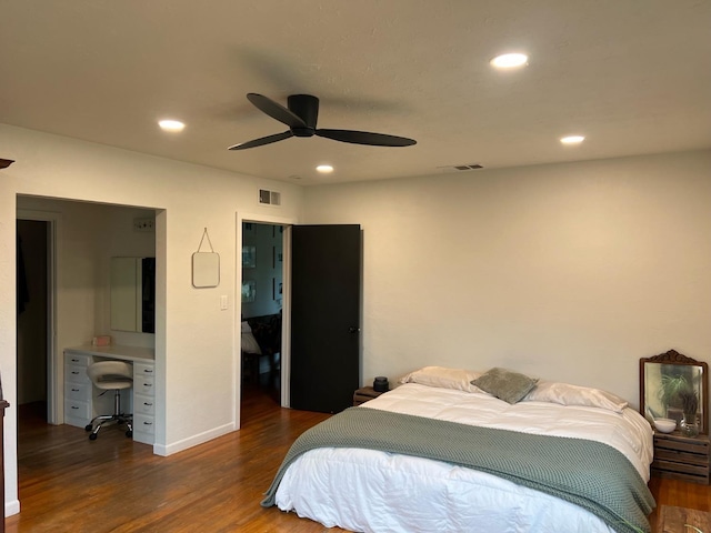 bedroom with dark wood-type flooring and ceiling fan