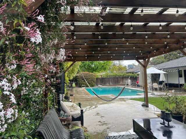 view of pool with a patio area and a pergola