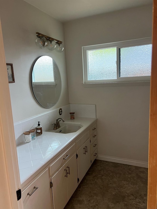 bathroom with plenty of natural light and vanity