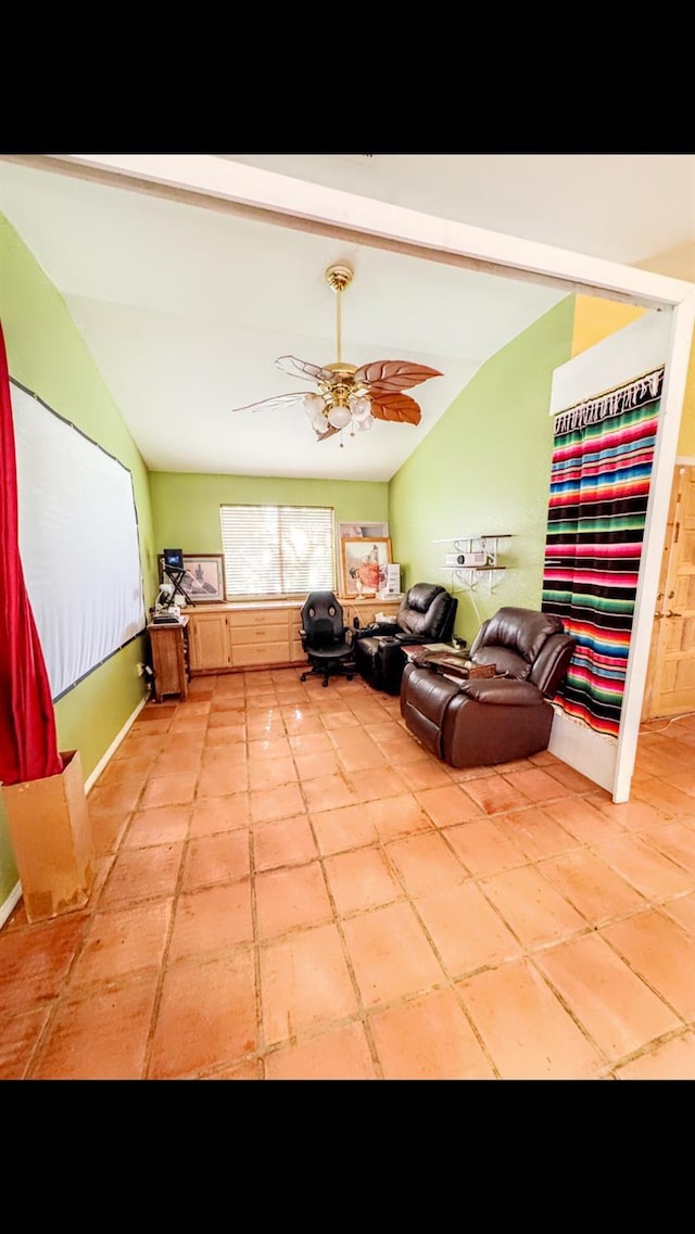 interior space featuring vaulted ceiling and ceiling fan