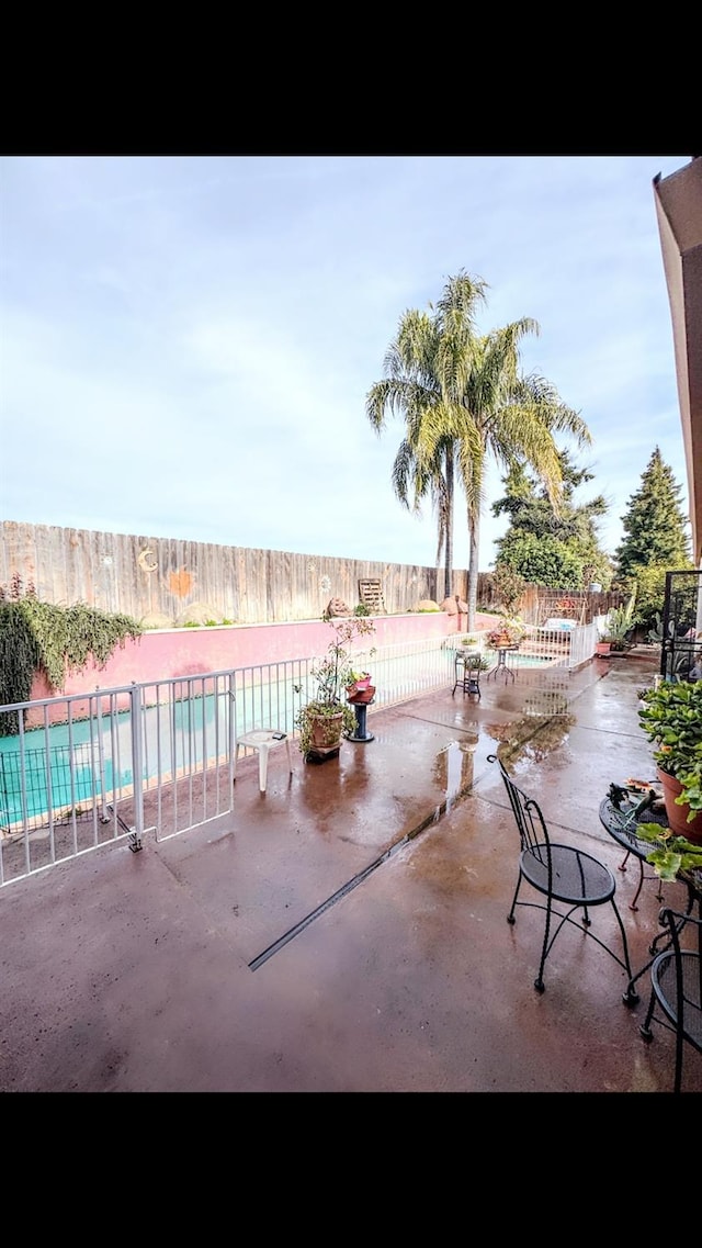 view of patio / terrace featuring a fenced in pool