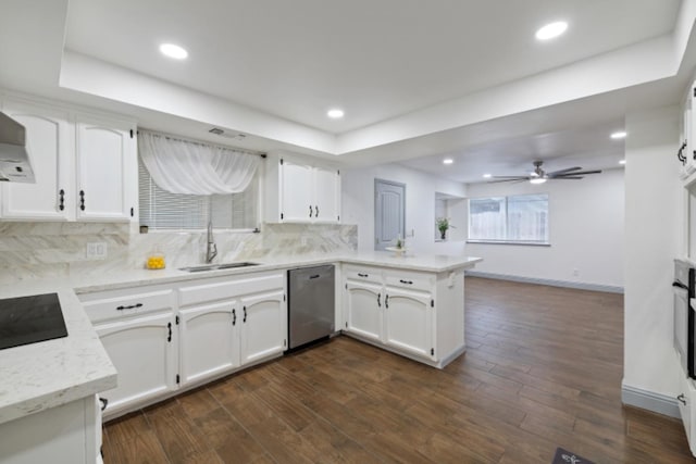 kitchen with white cabinets, kitchen peninsula, and dishwasher