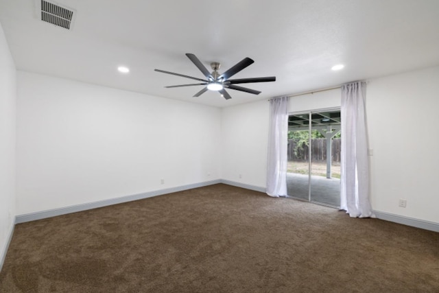 carpeted spare room with ceiling fan