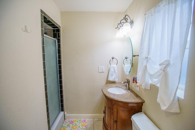 bathroom with vanity, tile patterned flooring, and a shower with door