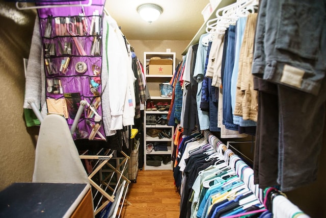 spacious closet featuring hardwood / wood-style floors