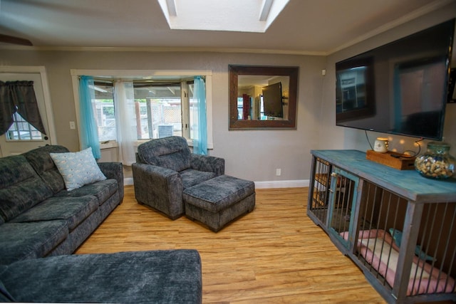 living room featuring crown molding and light hardwood / wood-style floors