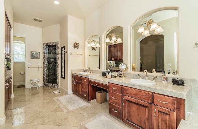 bathroom with vanity and a shower