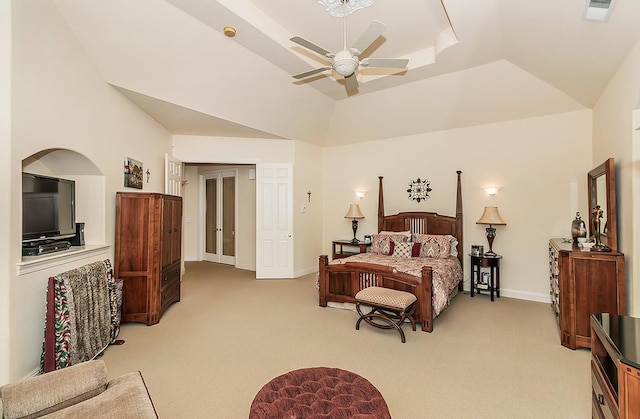 bedroom featuring light colored carpet, ceiling fan, and a tray ceiling