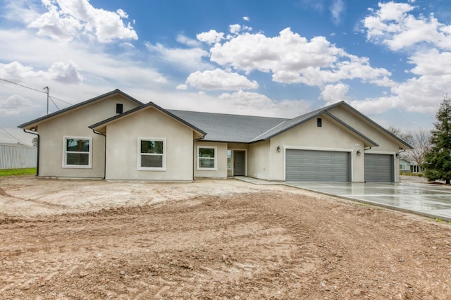 35710 Bonadelle Ave, Madera, CA 93636 - ranch-style house featuring concrete driveway, roof with shingles, stucco siding, and a garage