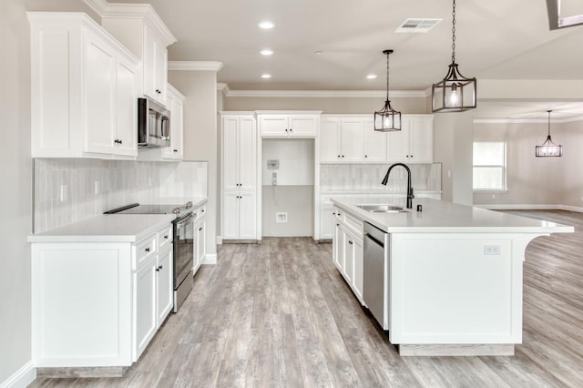 35710 Bonadelle Ave, Madera, CA 93636 - kitchen with a sink, decorative backsplash, a center island with sink, appliances with stainless steel finishes, and visible vents