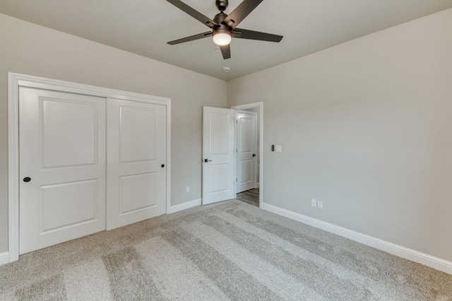 35710 Bonadelle Ave, Madera, CA 93636 - unfurnished bedroom with a ceiling fan, baseboards, carpet floors, and a closet