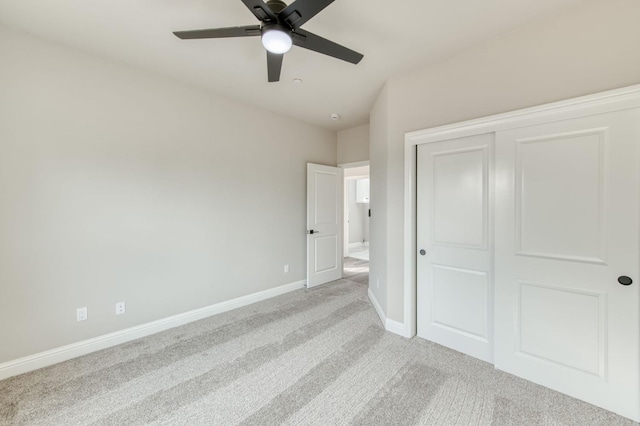 35710 Bonadelle Ave, Madera, CA 93636 - unfurnished bedroom with light colored carpet, ceiling fan, baseboards, and a closet