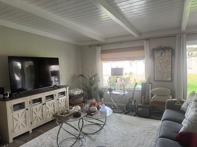 living room with beamed ceiling and wood finished floors