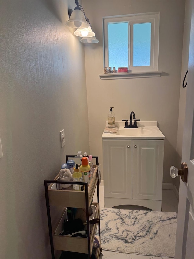 bathroom with vanity and baseboards