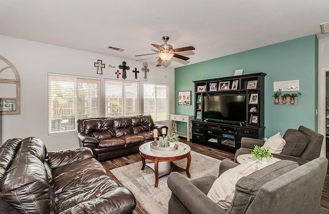 living room with hardwood / wood-style flooring and ceiling fan