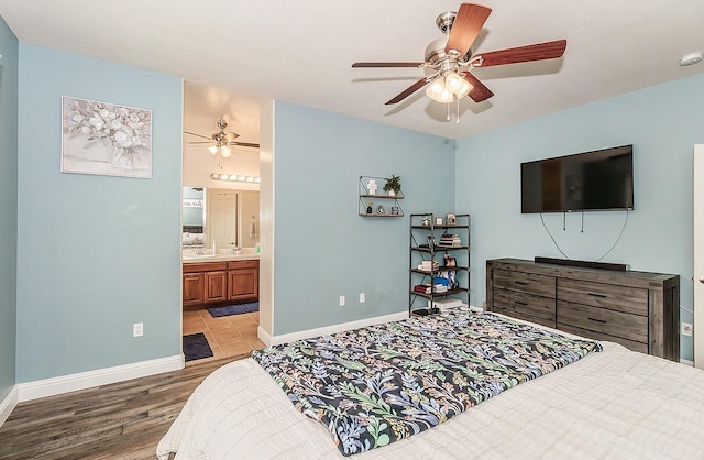 bedroom with ceiling fan, wood-type flooring, and ensuite bathroom