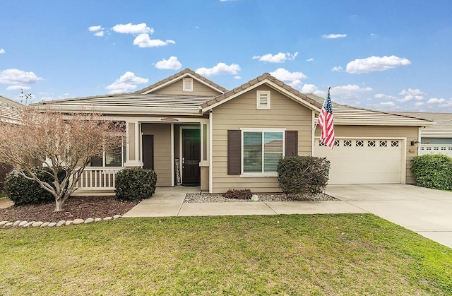 view of front of house featuring a garage and a front lawn