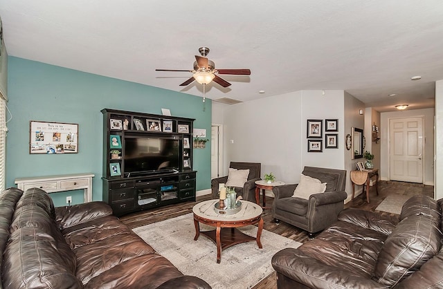 living room featuring hardwood / wood-style flooring and ceiling fan