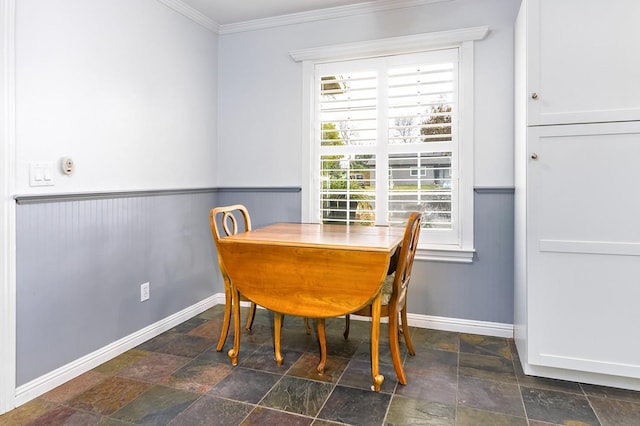 dining area featuring ornamental molding and a healthy amount of sunlight