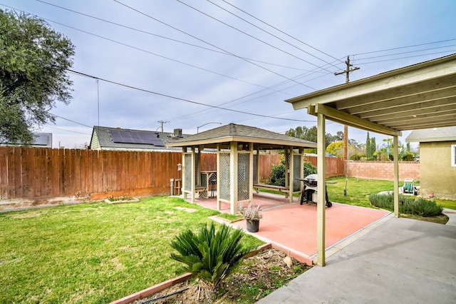 view of yard featuring a gazebo and a patio area