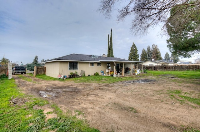 rear view of property featuring a patio area