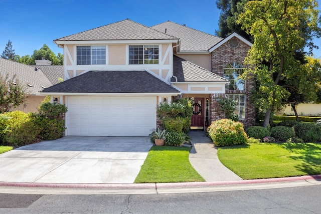 front facade featuring a garage and a front lawn