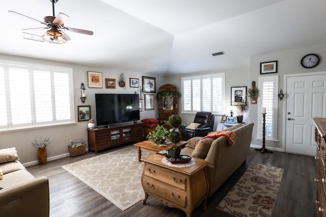 living room with lofted ceiling, hardwood / wood-style floors, and ceiling fan