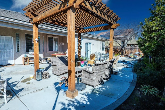 view of patio featuring an outdoor hangout area and a pergola