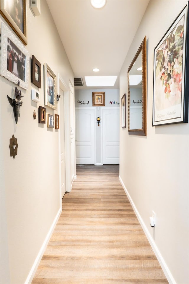 hall featuring light hardwood / wood-style flooring