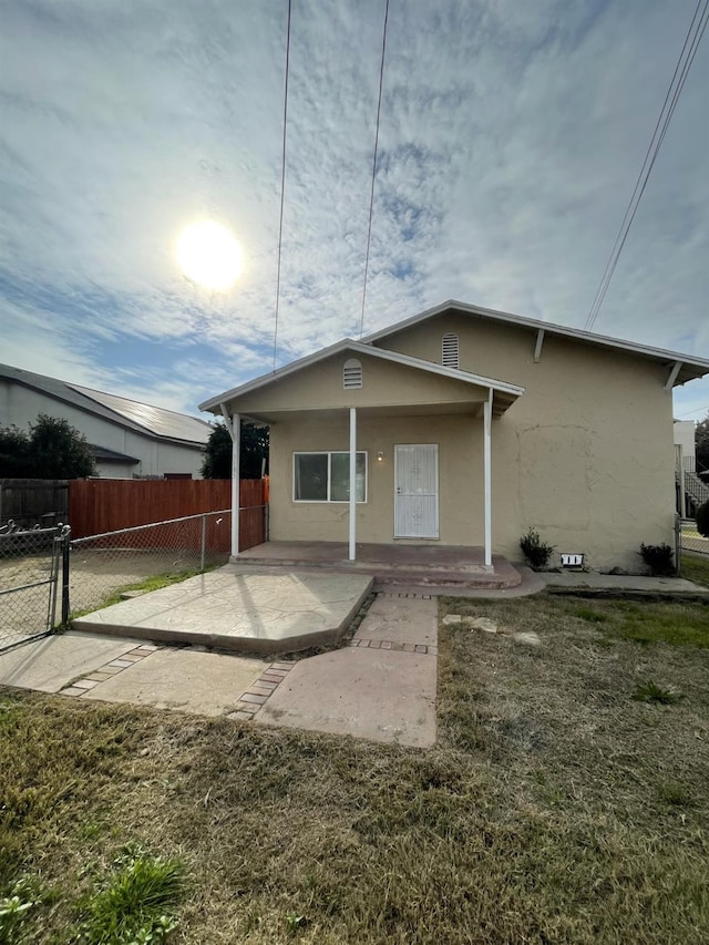 3185 W Mckinley, Fresno, CA 93722 - view of front of house featuring stucco siding and fence