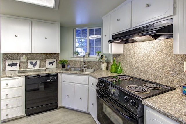 kitchen featuring white cabinetry, sink, decorative backsplash, light hardwood / wood-style floors, and black appliances