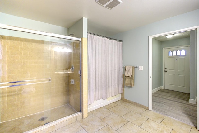 bathroom featuring tile patterned floors and a shower with shower curtain