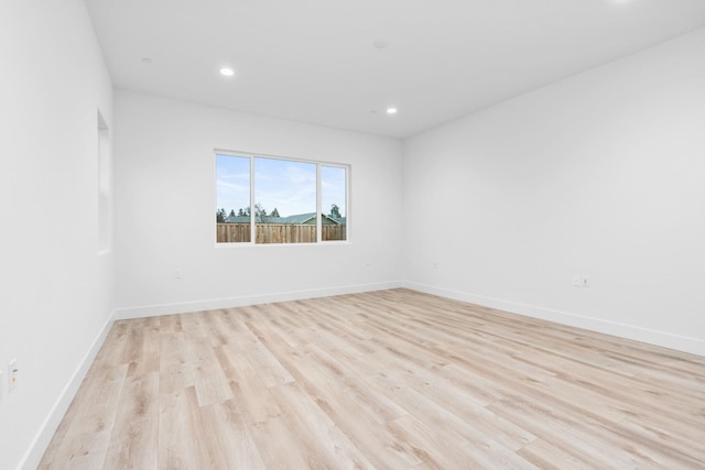 unfurnished room featuring light hardwood / wood-style floors