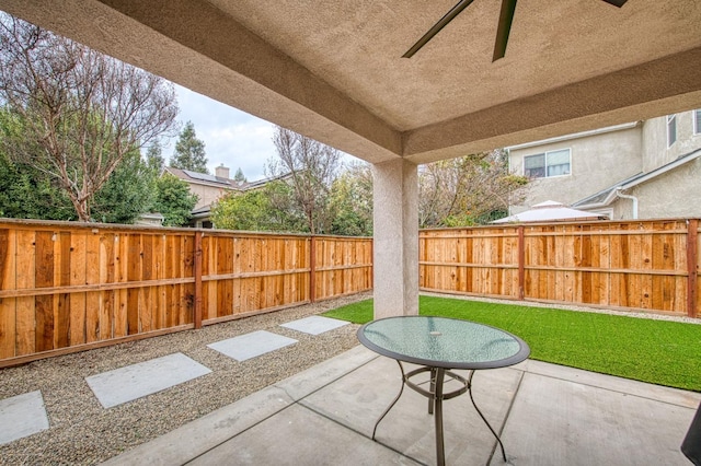 view of patio featuring ceiling fan