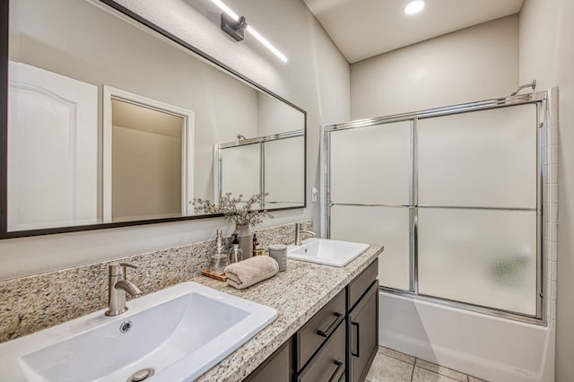 bathroom with vanity, combined bath / shower with glass door, and tile patterned floors