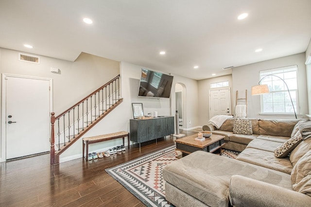 living room featuring dark wood-type flooring