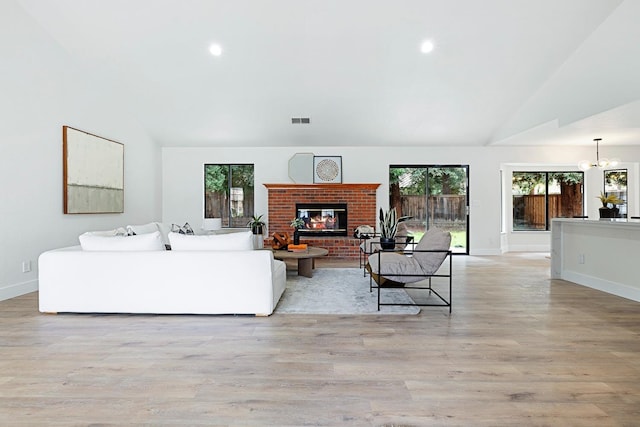 5017 W Locust Ave, Fresno, CA 93722 - living area featuring a fireplace, recessed lighting, light wood-style flooring, and high vaulted ceiling